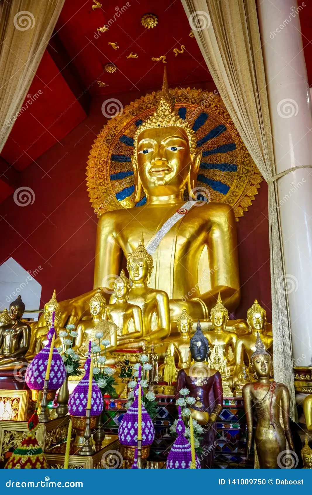 a large gold statue of a buddha
