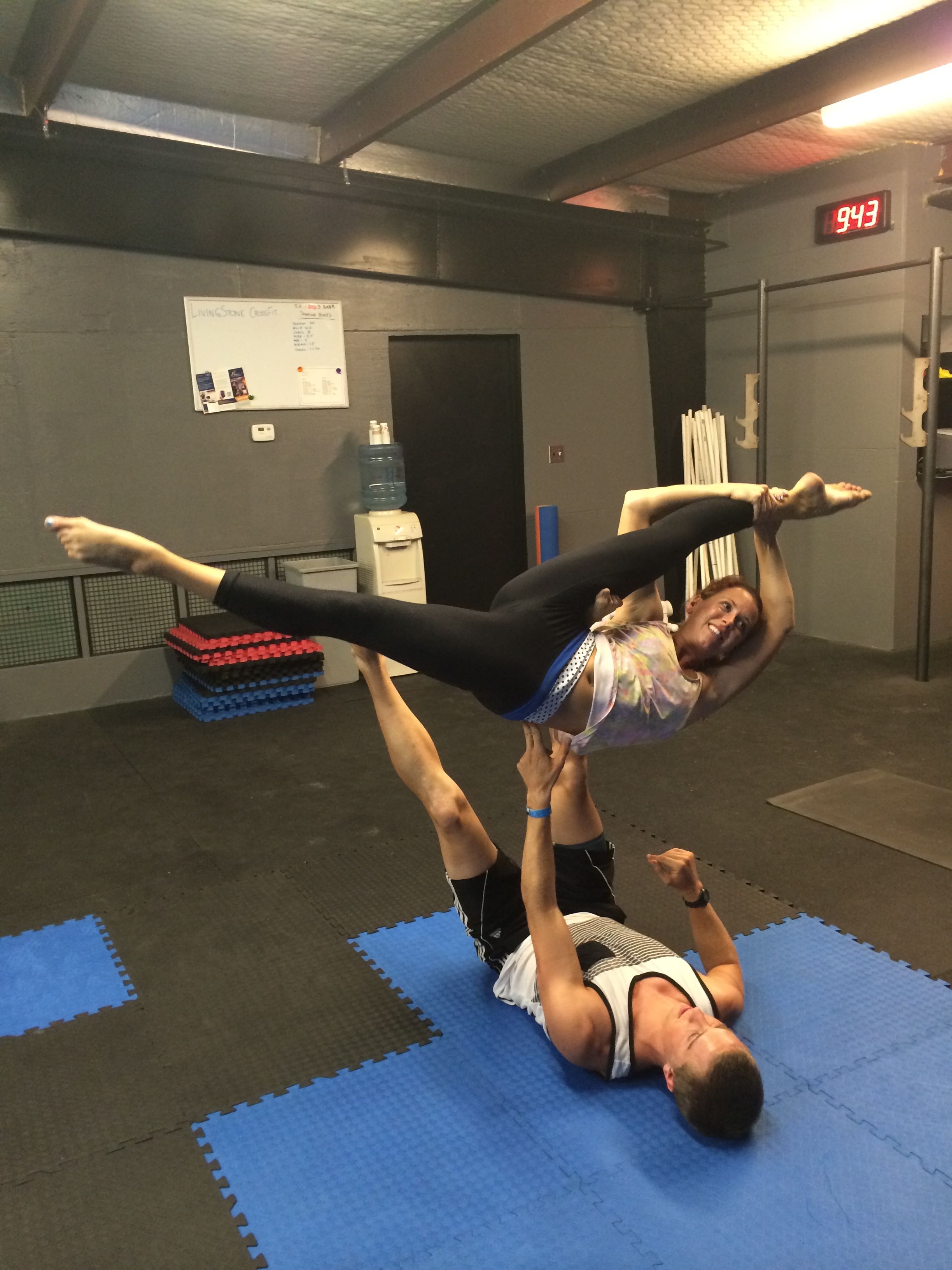 a man and woman doing acrobatic exercises