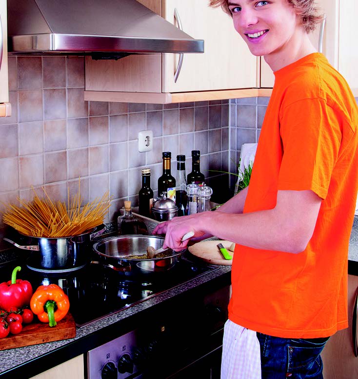 a man cooking in a kitchen