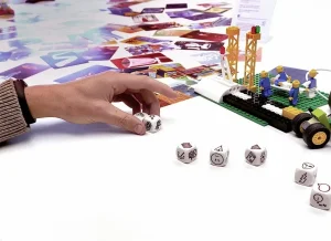 a hand placing dice on a table