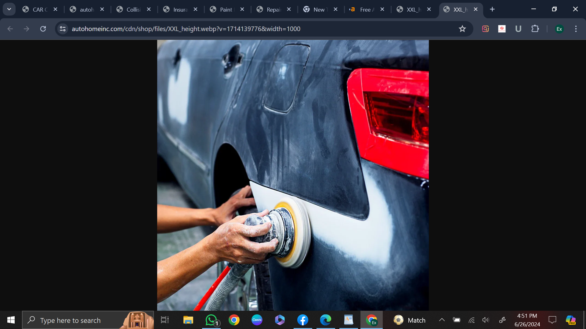 a person using a machine to polish a car