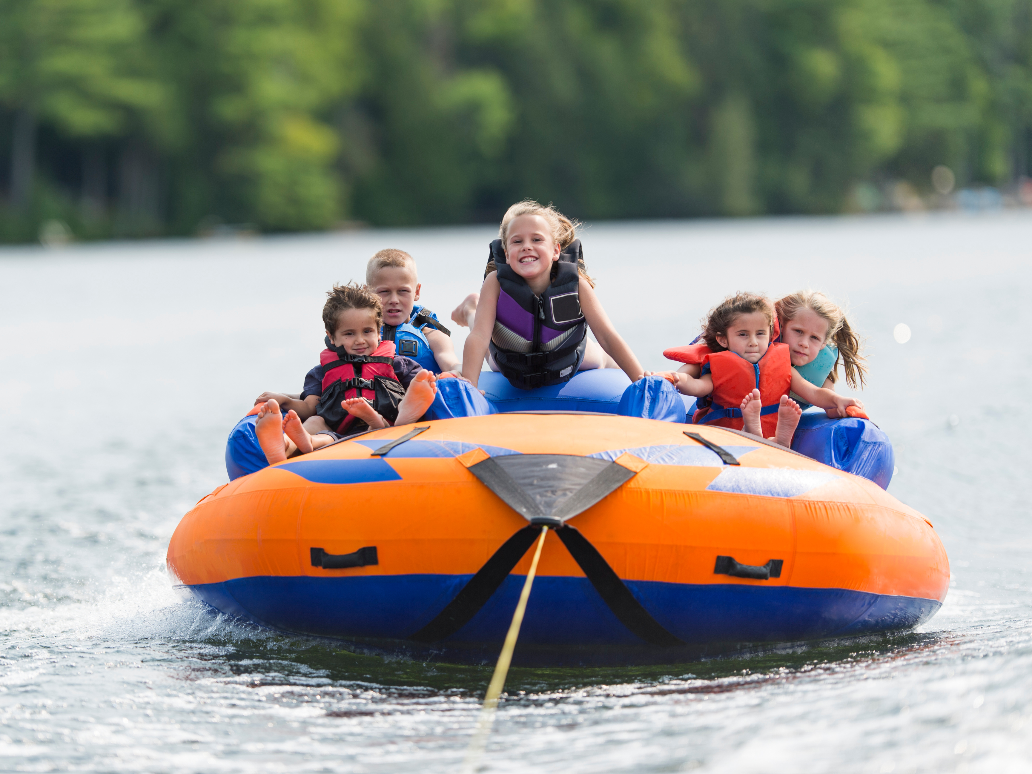 a group of kids on a raft