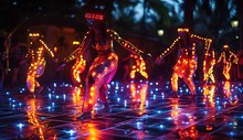 a group of people dancing with lights