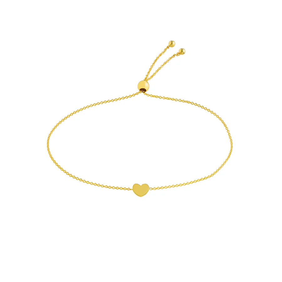 a gold bracelet with a heart on it