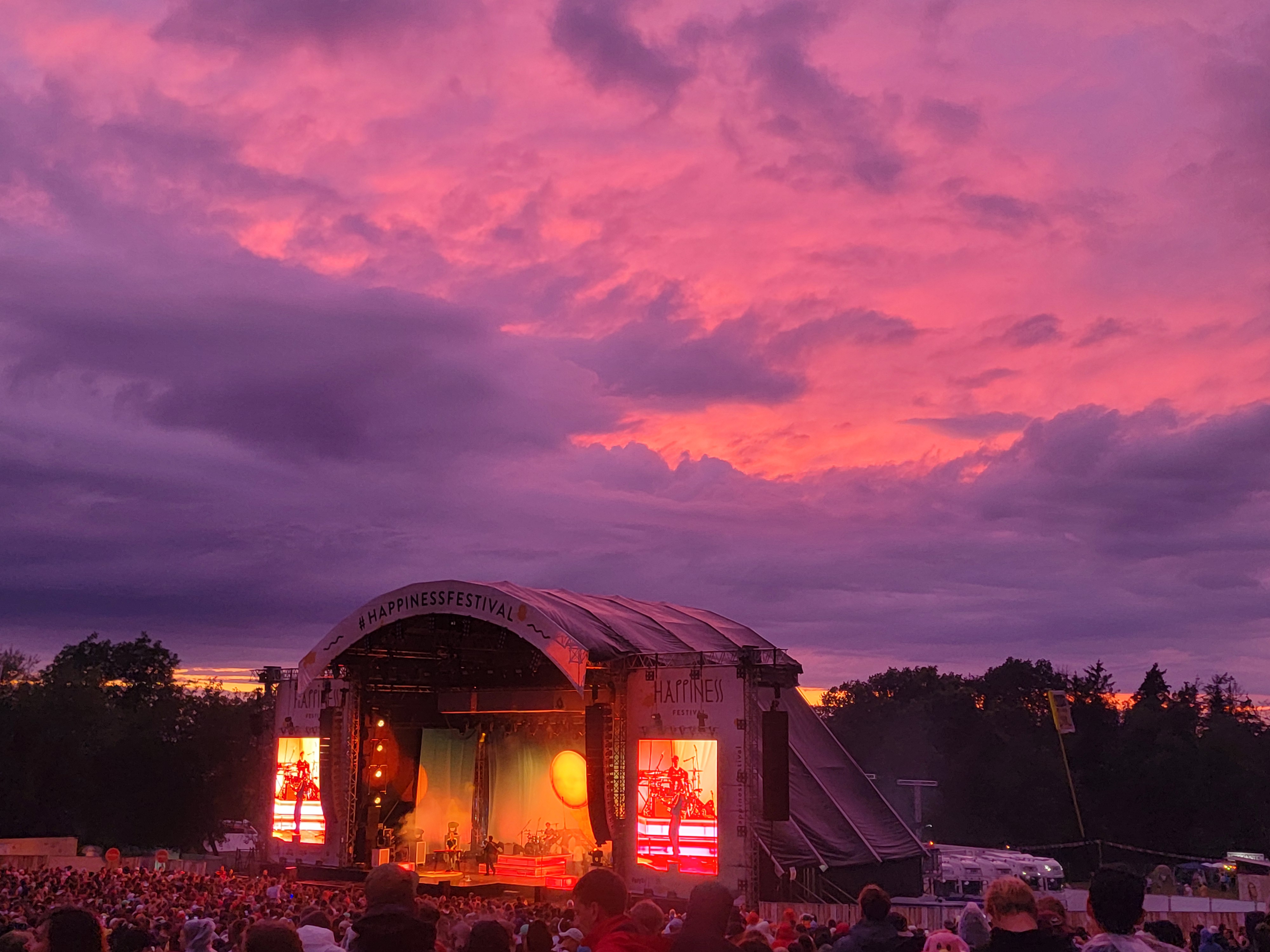 a large crowd of people watching a stage