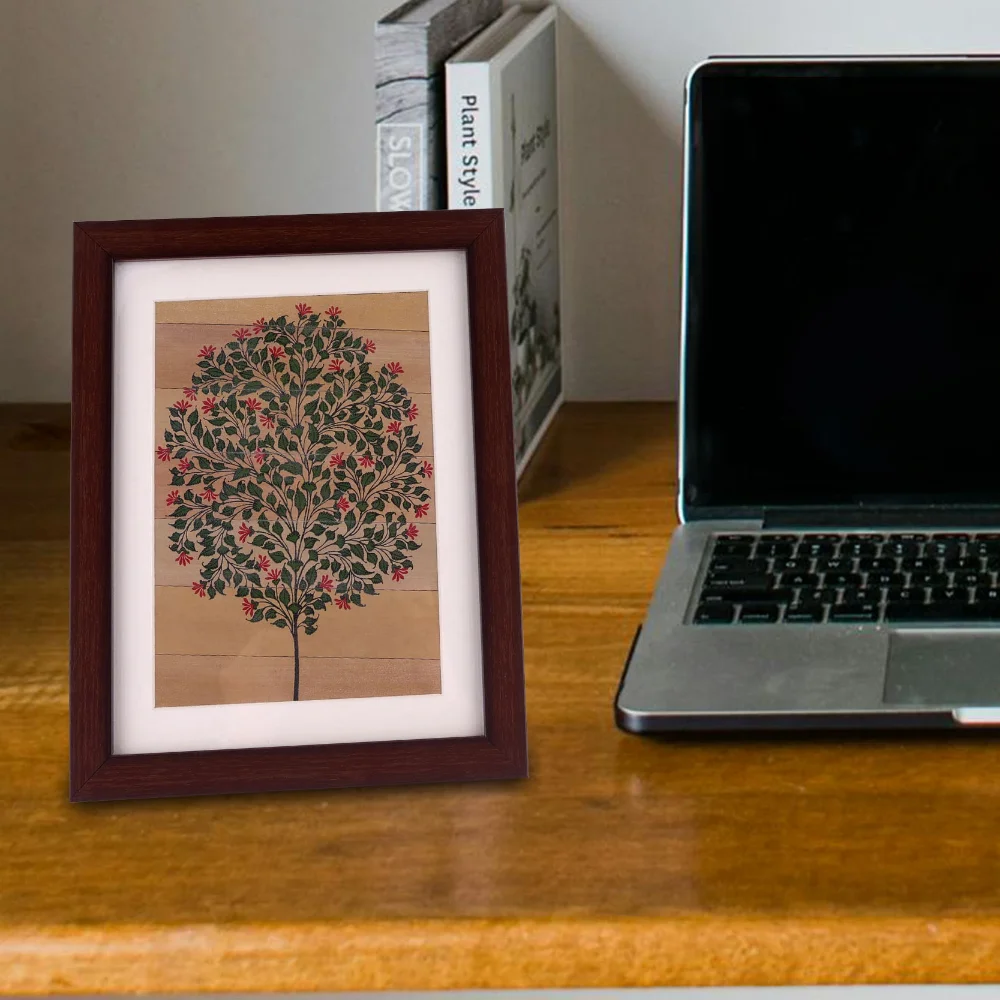 a picture frame next to a laptop