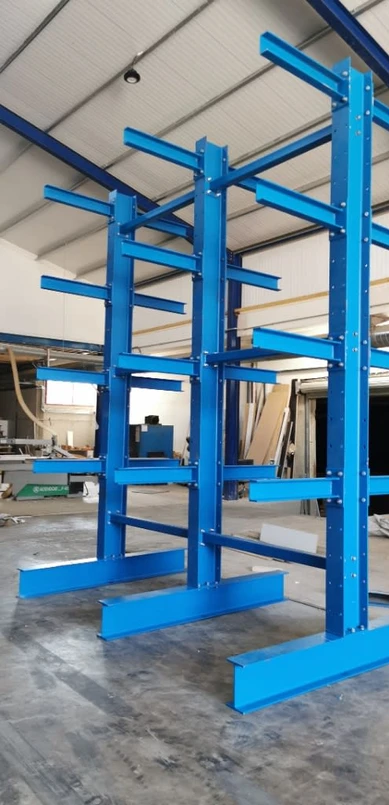 a blue metal rack in a warehouse