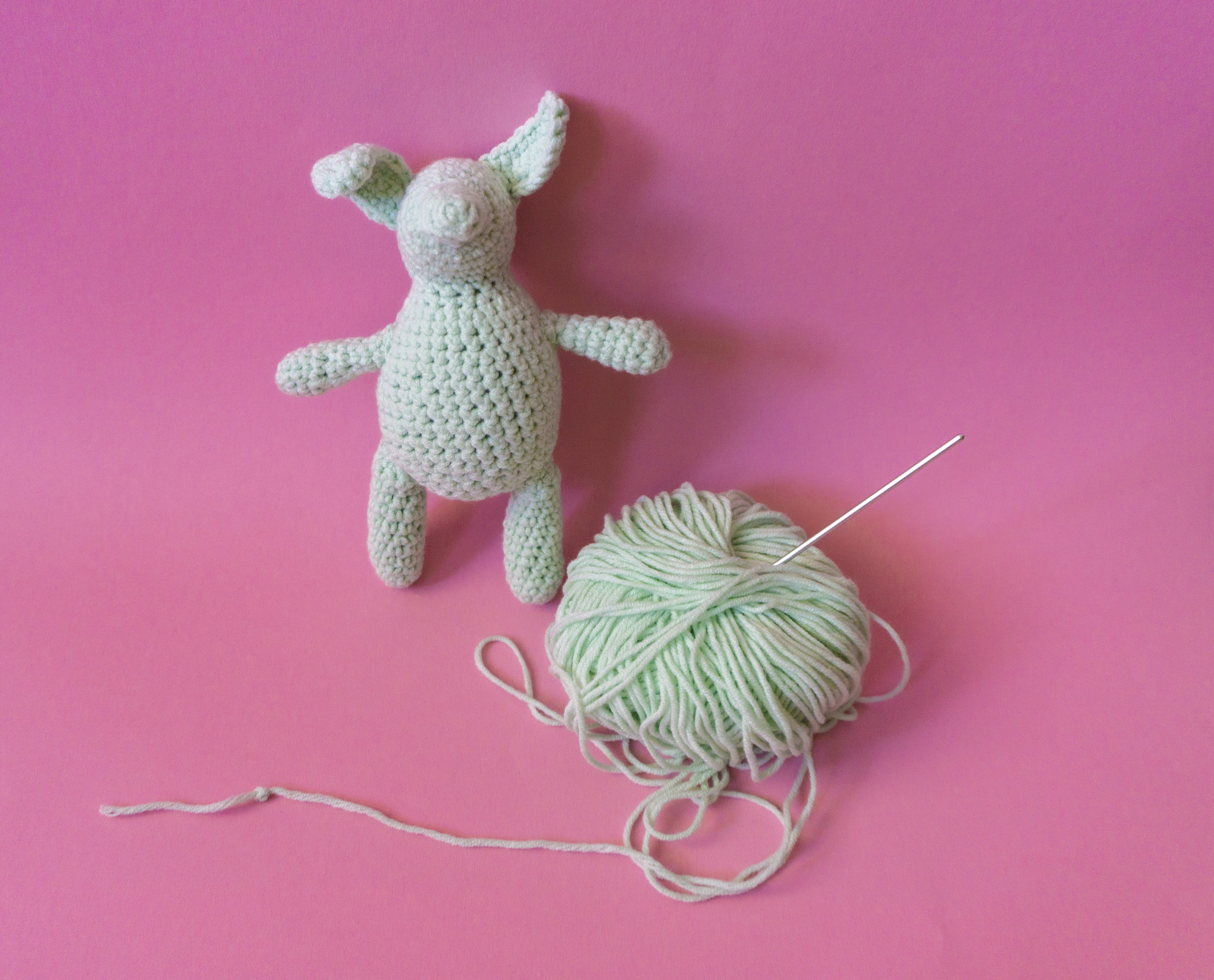 a yarn ball and a stuffed animal