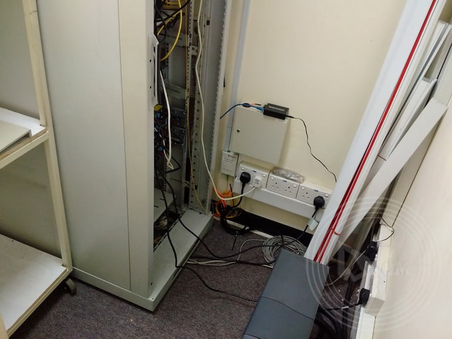 a white cabinet with wires and wires