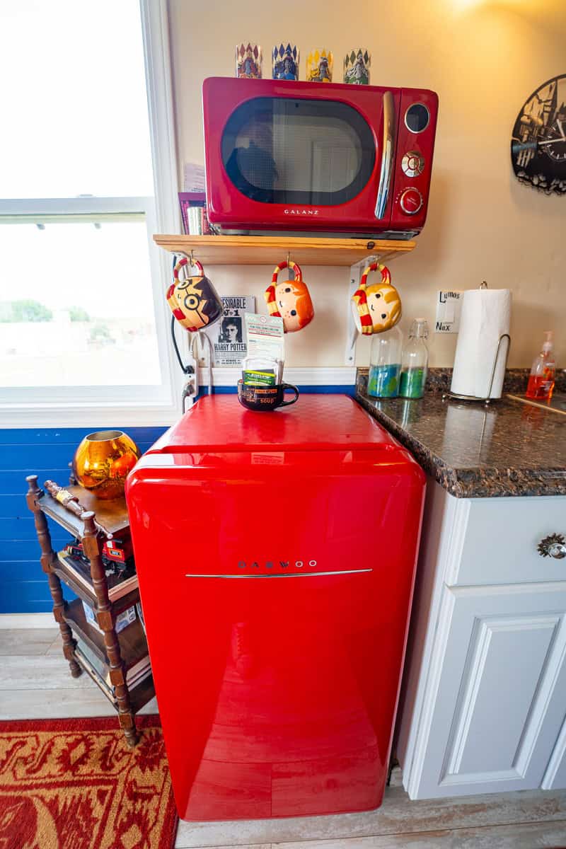 a red refrigerator and a microwave