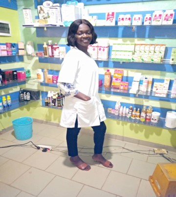 a woman standing in a pharmacy