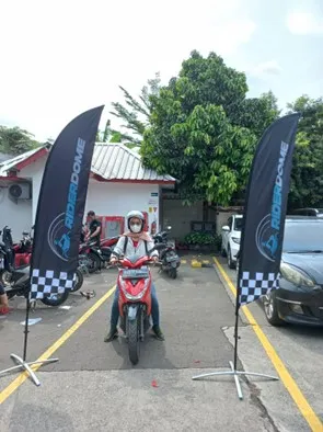 a person on a motorcycle with flags