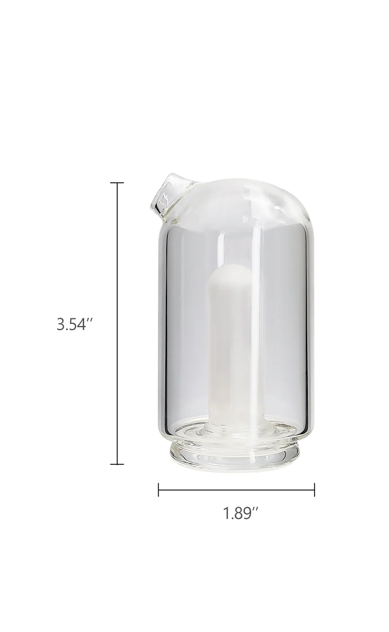 a glass container with a candle inside