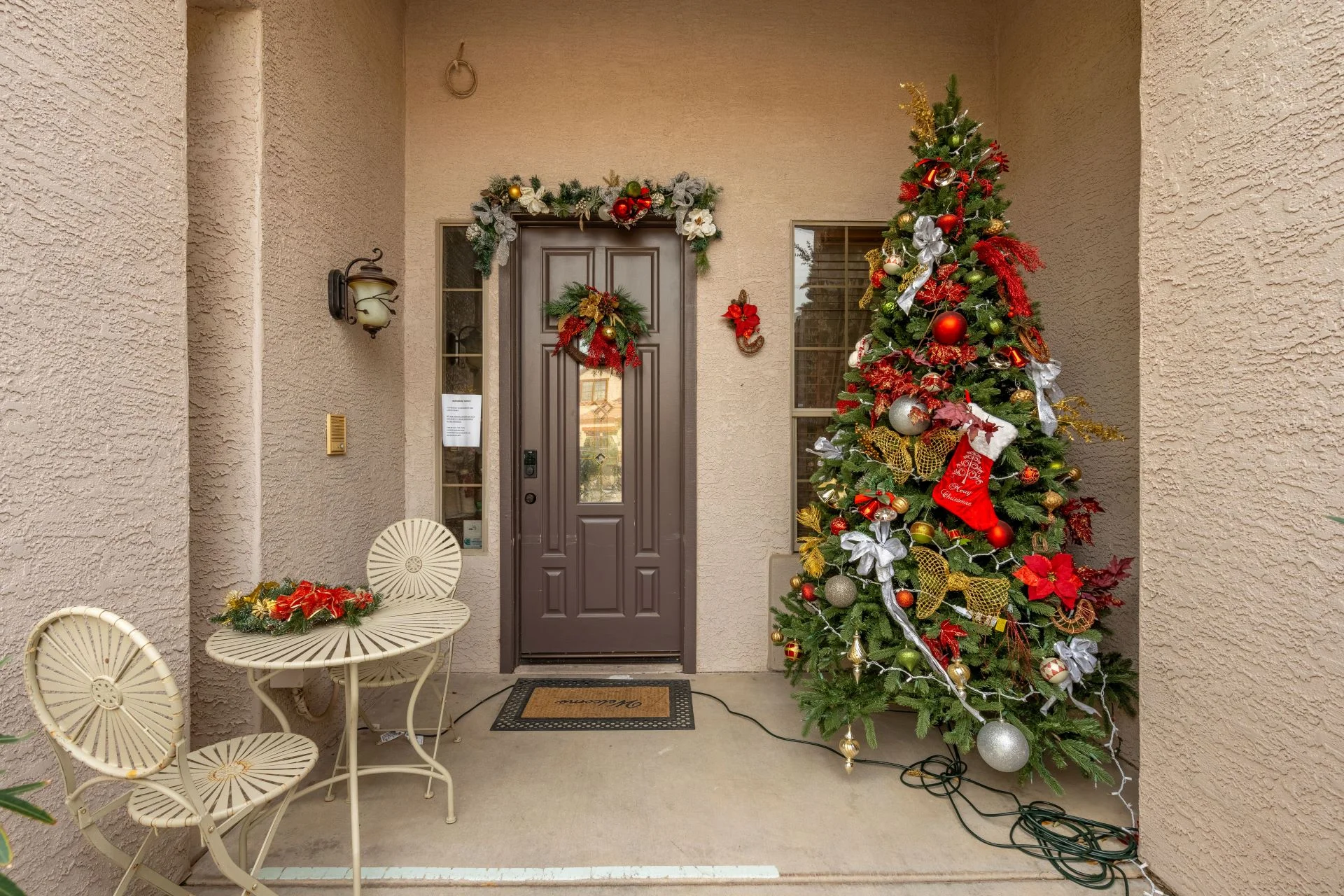 a christmas tree outside of a house