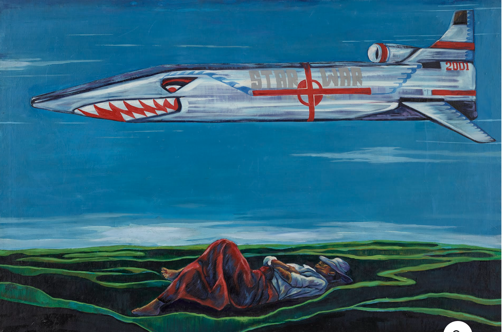 a man lying on a blanket and a jet flying over a green field
