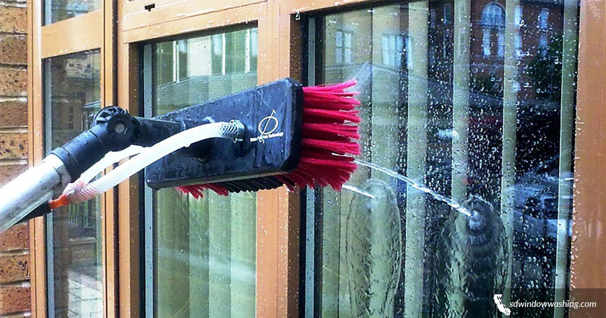 a brush cleaning a window