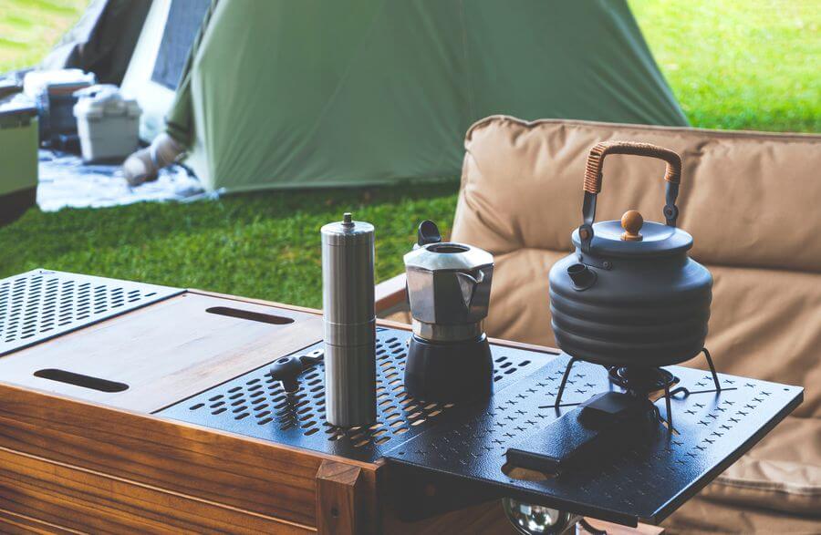 a table with a kettle and a coffee pot on it