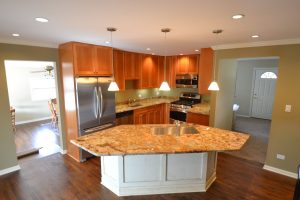 a kitchen with a marble island