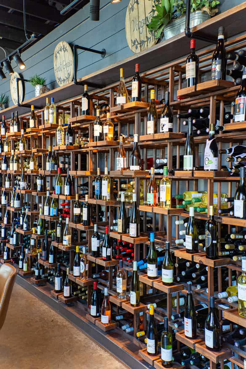 a shelf of wine bottles