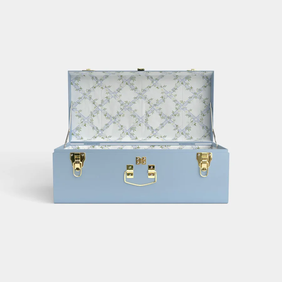 a blue suitcase with gold hardware