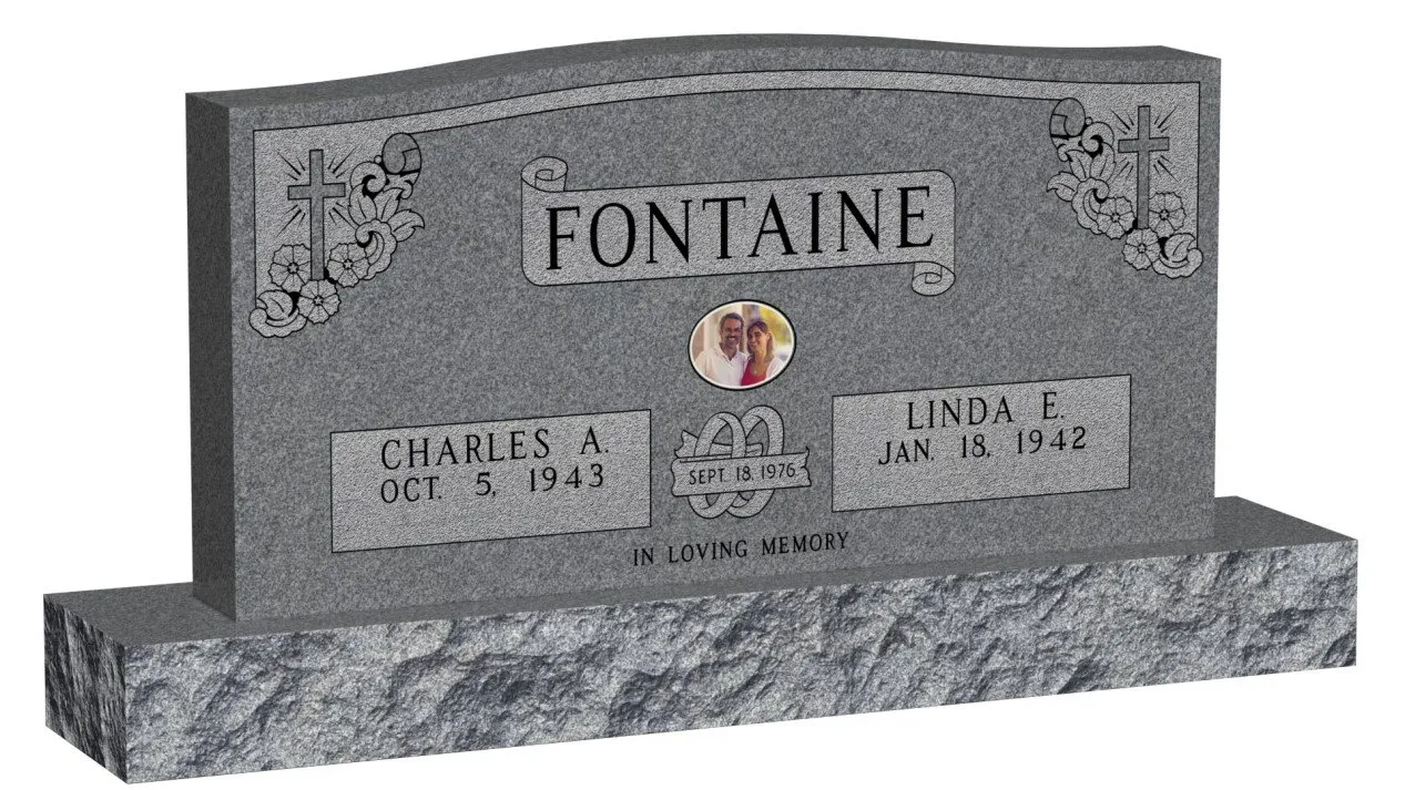 a grey tombstone with a couple of people's names