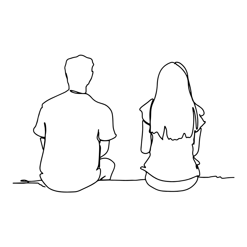 a man and woman sitting on the ground