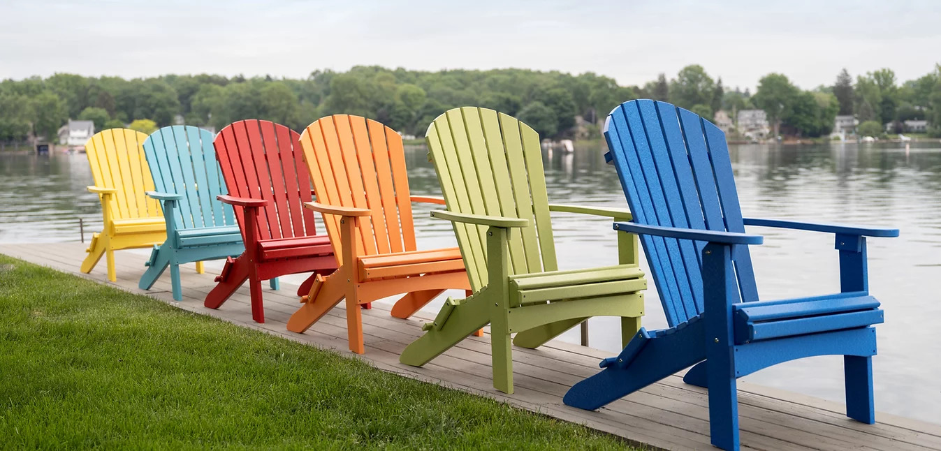 a row of colorful chairs on a dock