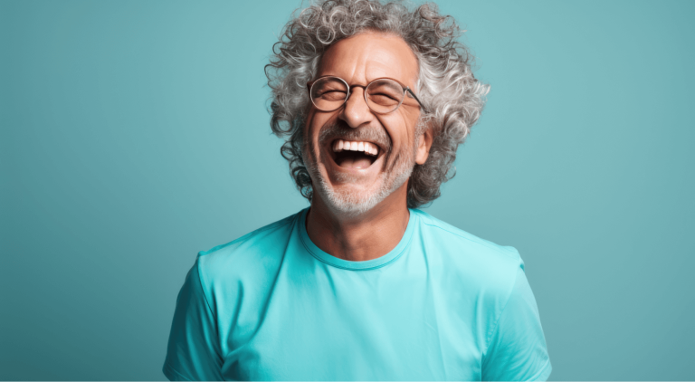 a man laughing with glasses
