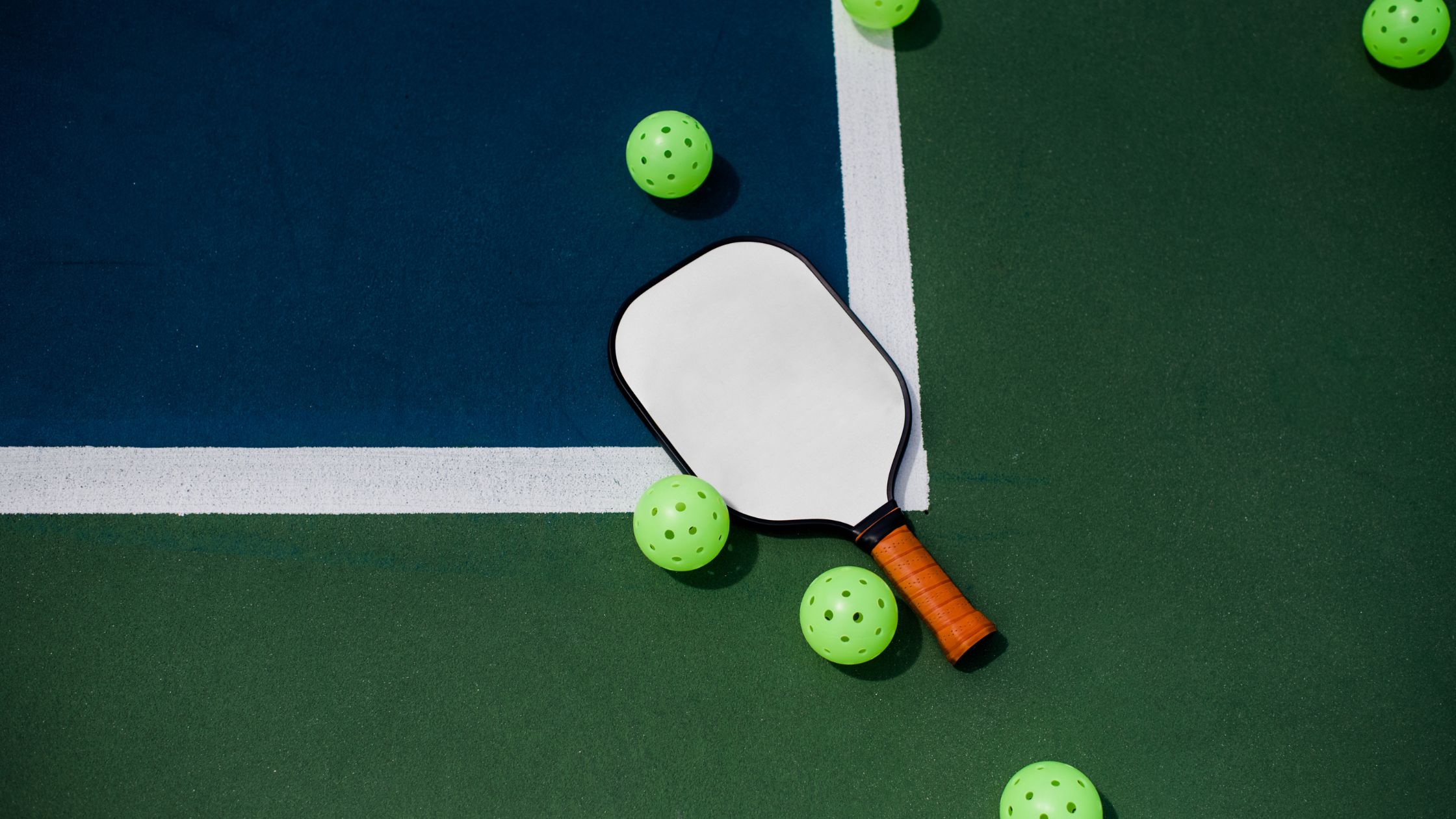a paddle and balls on a court