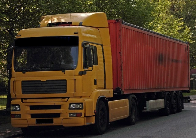 a yellow truck on the road