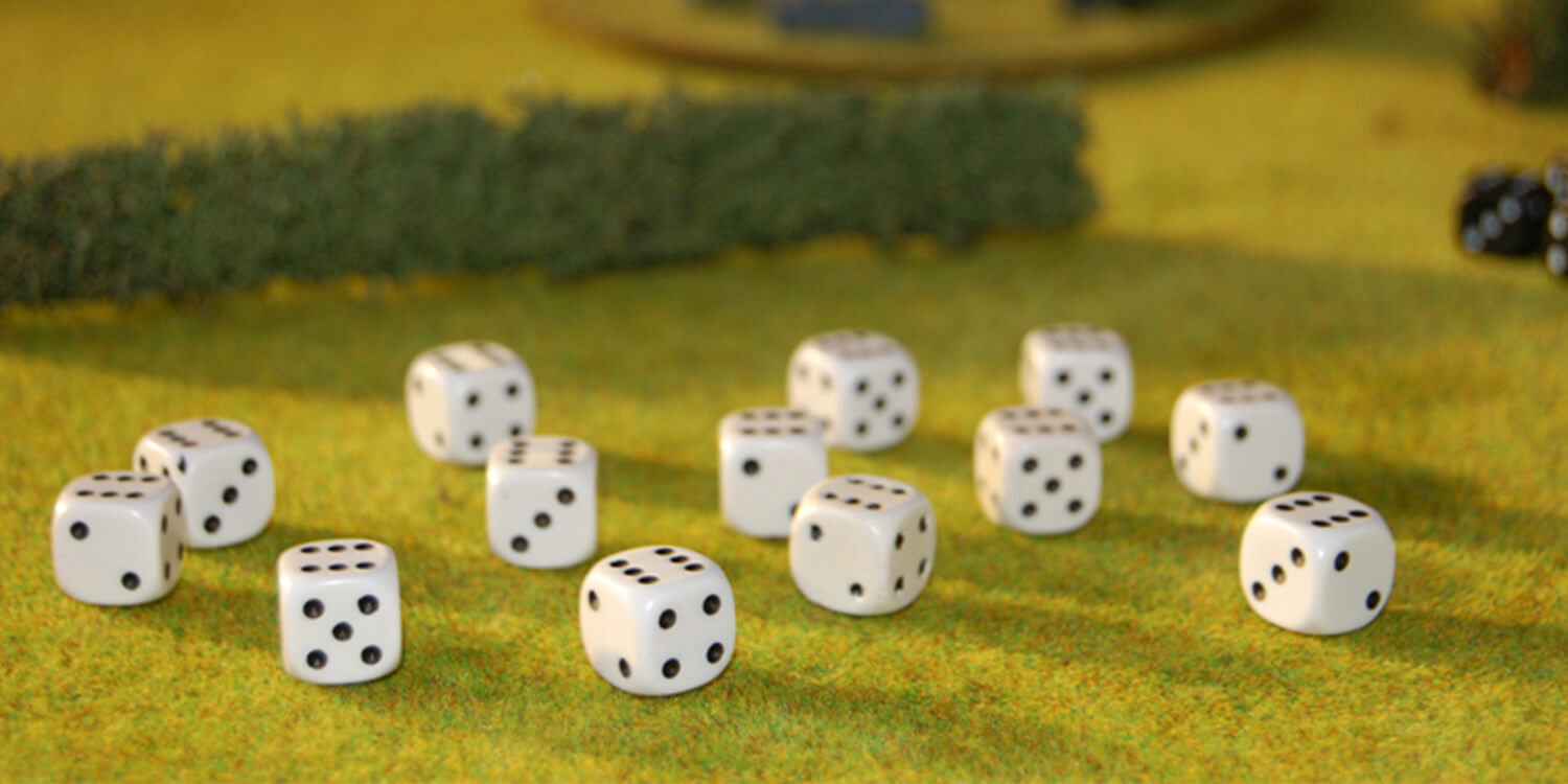a group of dice on a green surface