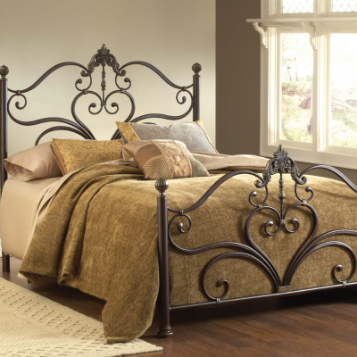 a bed with a metal headboard