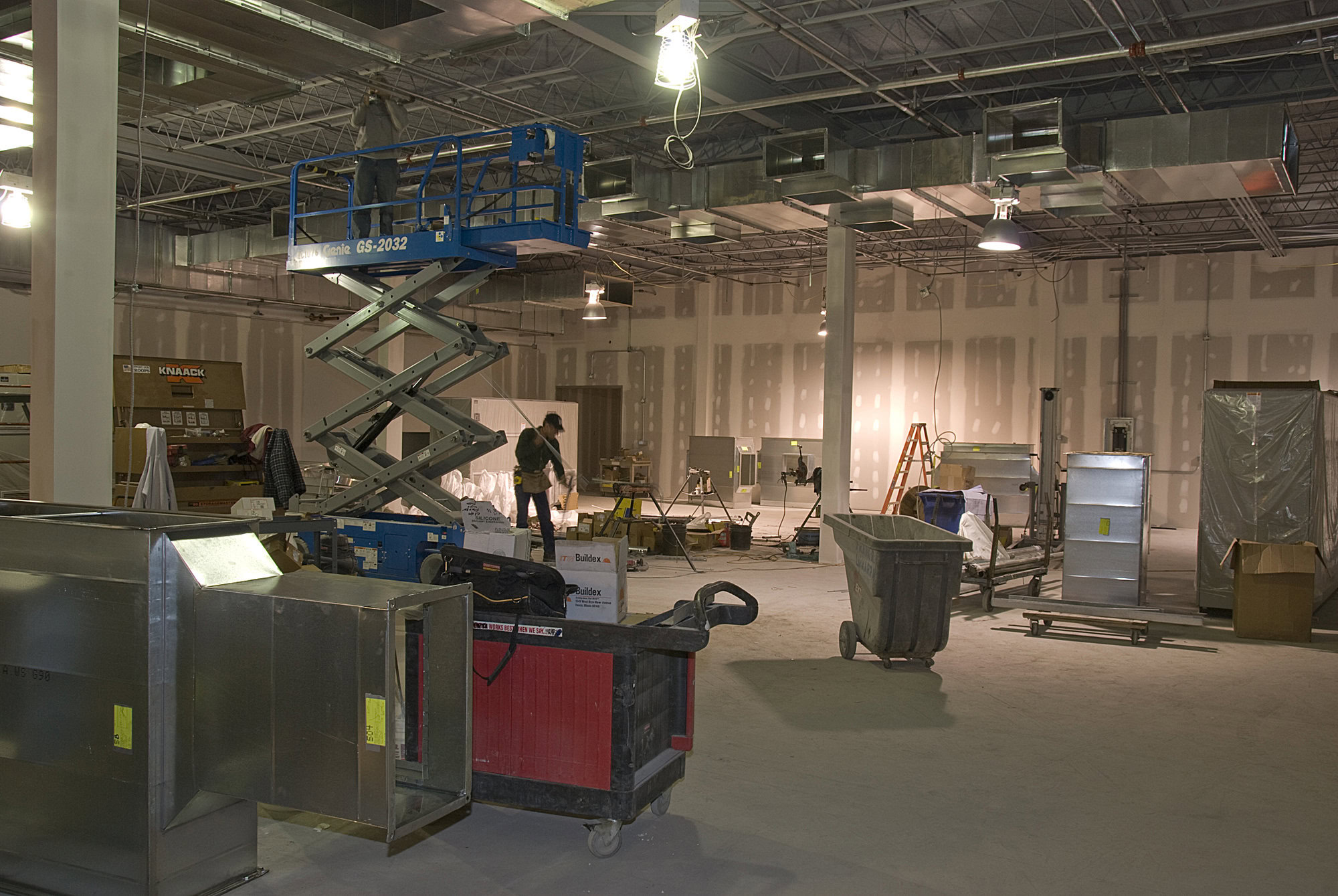 a man standing in a large warehouse