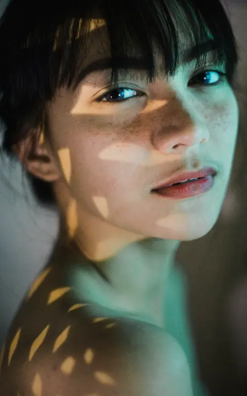 a woman with a light on her face
