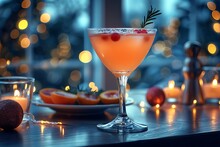 a glass of orange liquid with berries on a table