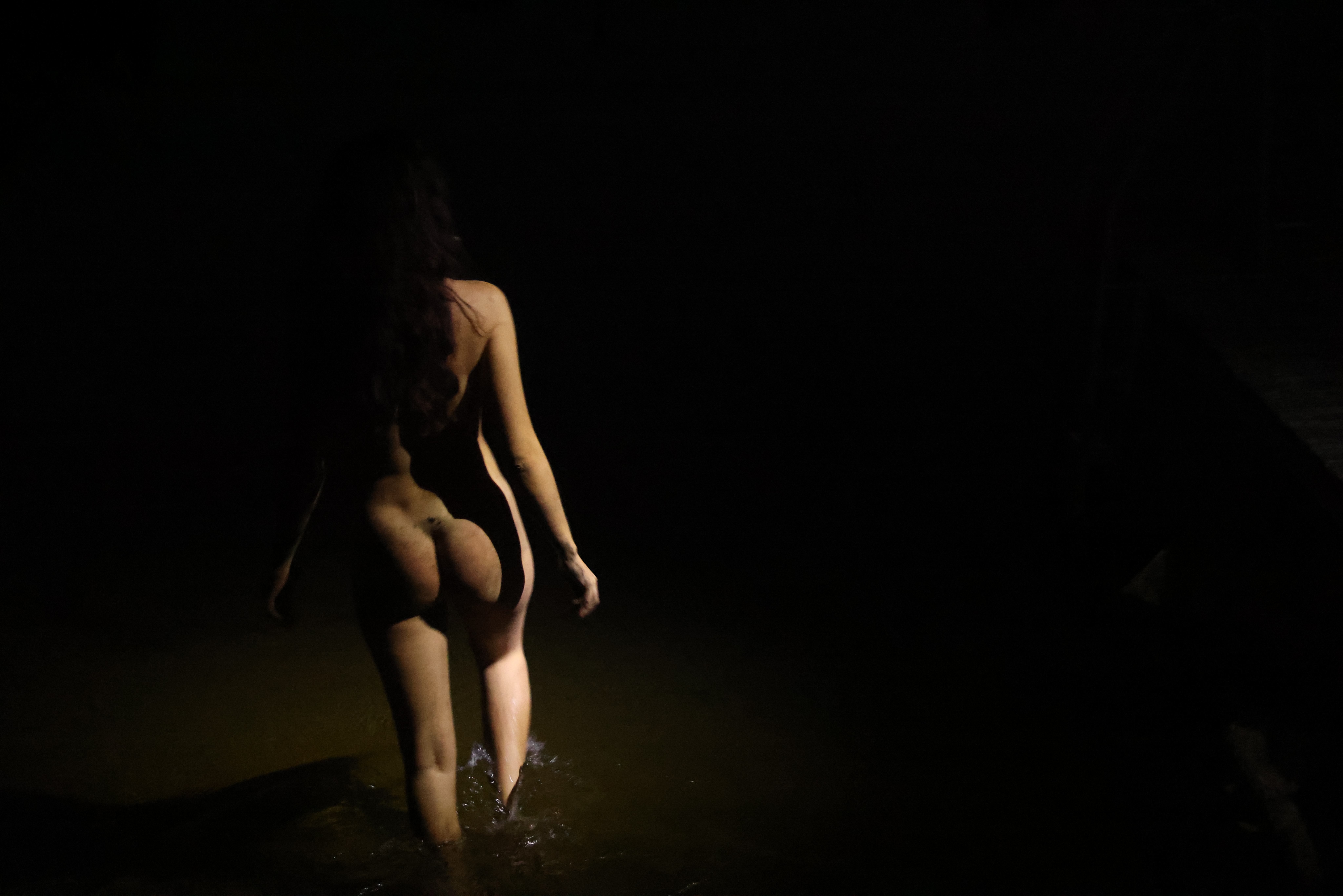 a woman walking in water